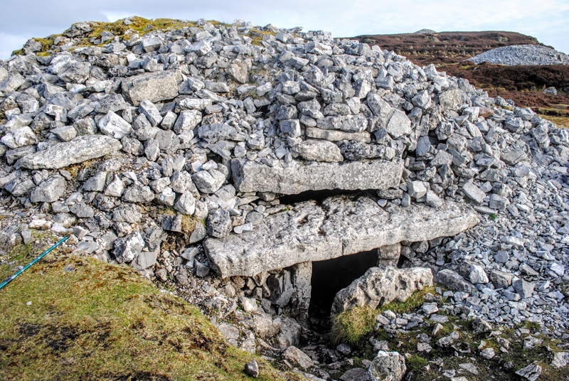 Neolithic passage tomb - a stone mound framed with huge lintels
